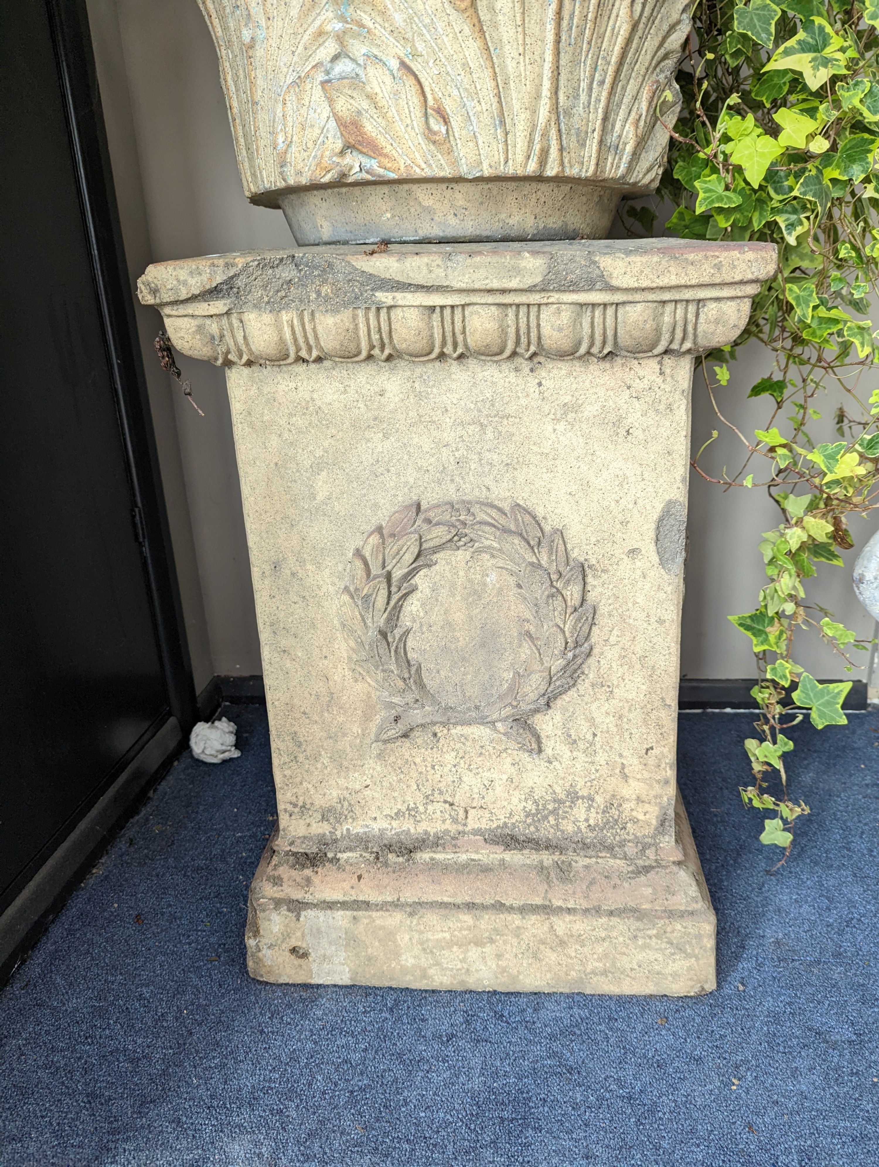 A pair of Victorian earthenware circular garden urns square plinth bases, diameter 58cm, height 96cm